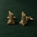 Broken Column Cufflinks, front view on green felt