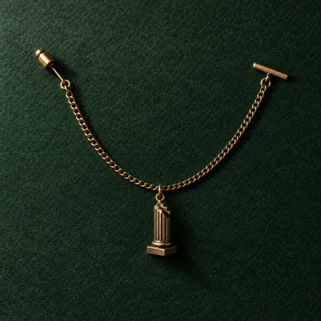 Broken Column Lapel Chain, front view on green felt