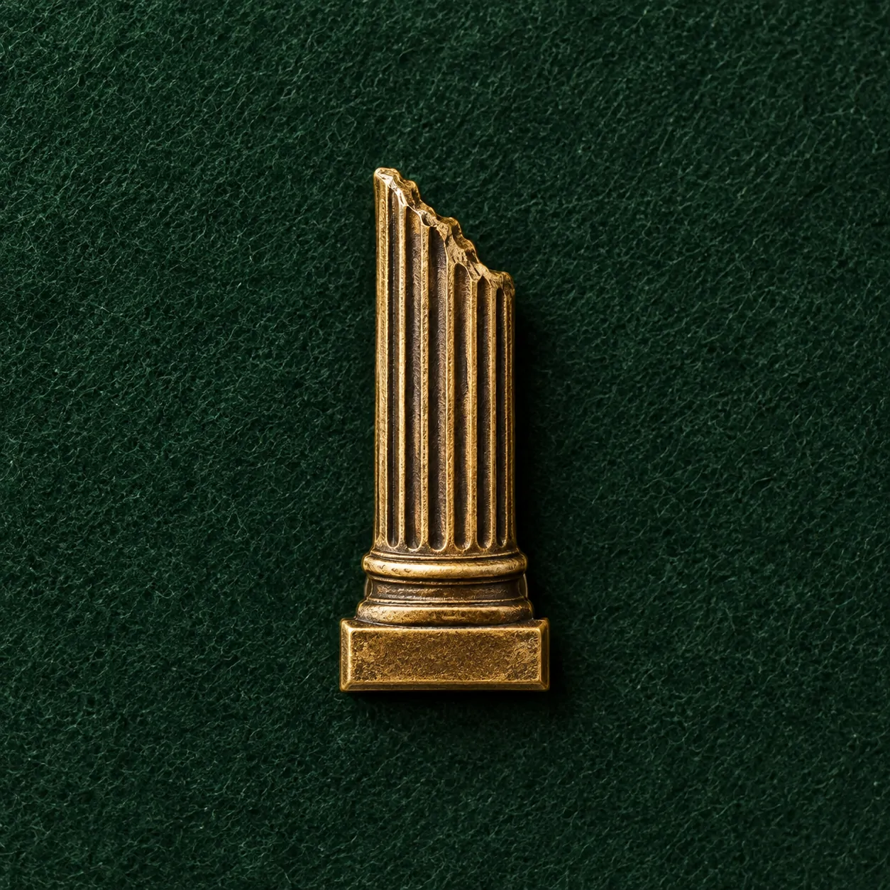Broken Column Lapel Pin, front view on green felt