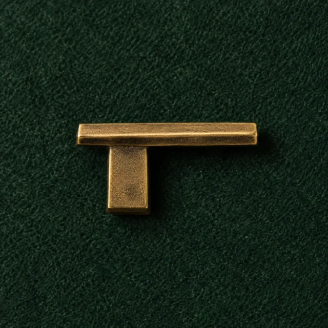 Cantilever Lapel Pin, front view on green felt