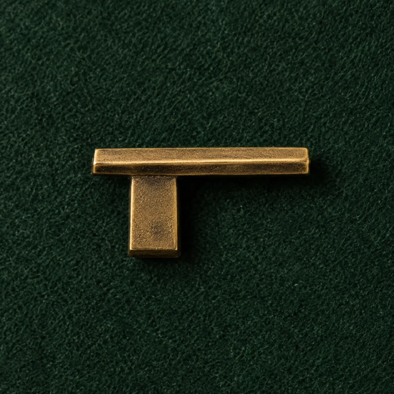 Cantilever Lapel Pin, front view on green felt