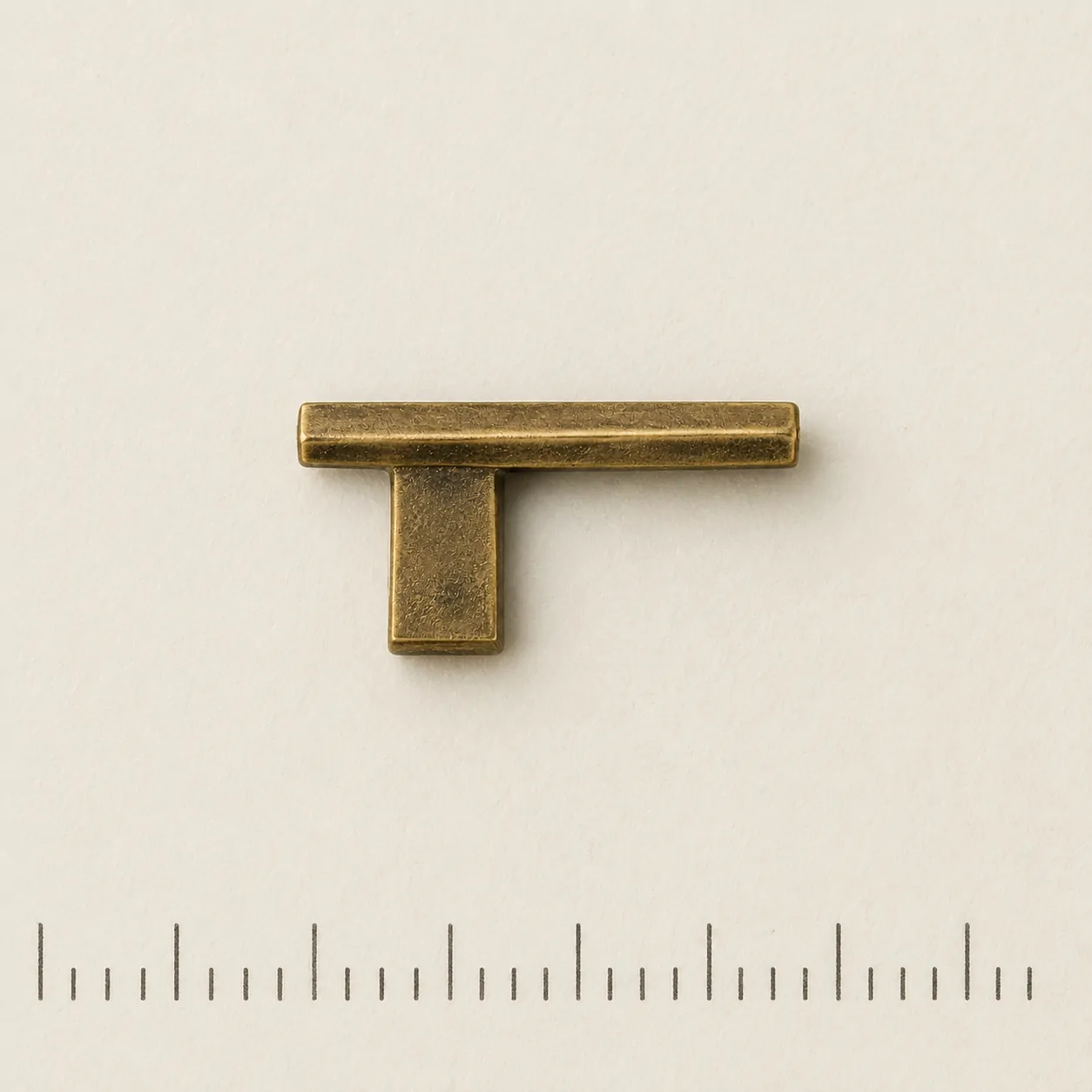 Cantilever Lapel Pin on a millimetre scale card