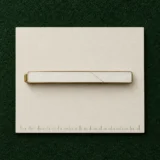 Cracked Tie Bar on a millimetre scale card