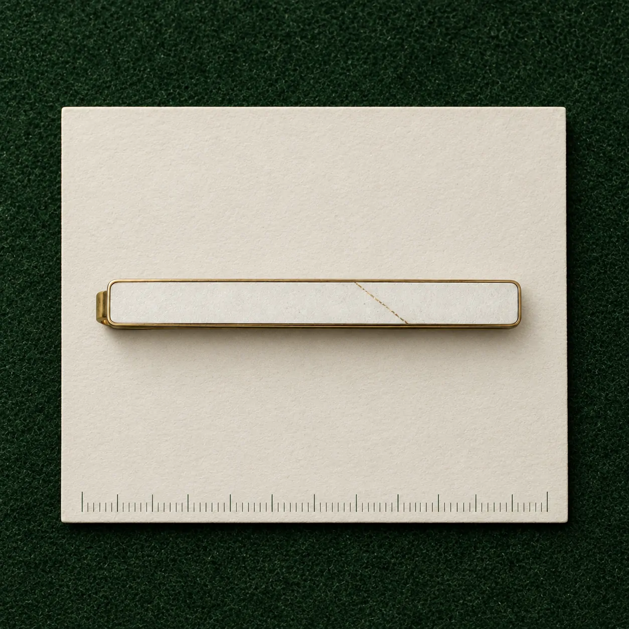 Cracked Tie Bar on a millimetre scale card