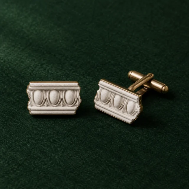 Egg and Dart Cufflinks, front view on green felt