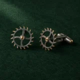 Escapement Wheel Cufflinks, front view on green felt