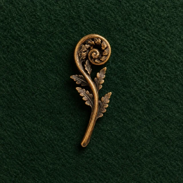 Fern Crozier Lapel Pin, front view on green felt