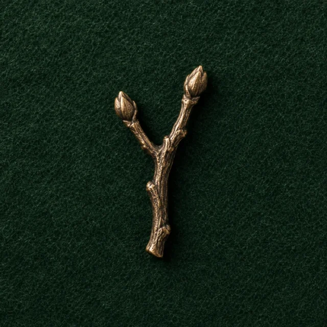 Forked Twig Lapel Pin, front view on green felt
