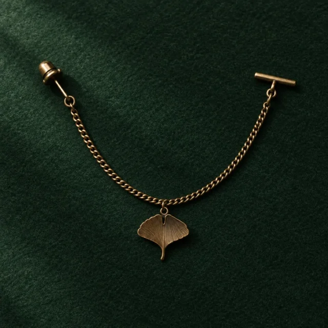 Ginkgo Leaf Lapel Chain, front view on green felt