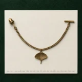Ginkgo Leaf Lapel Chain on a millimetre scale card