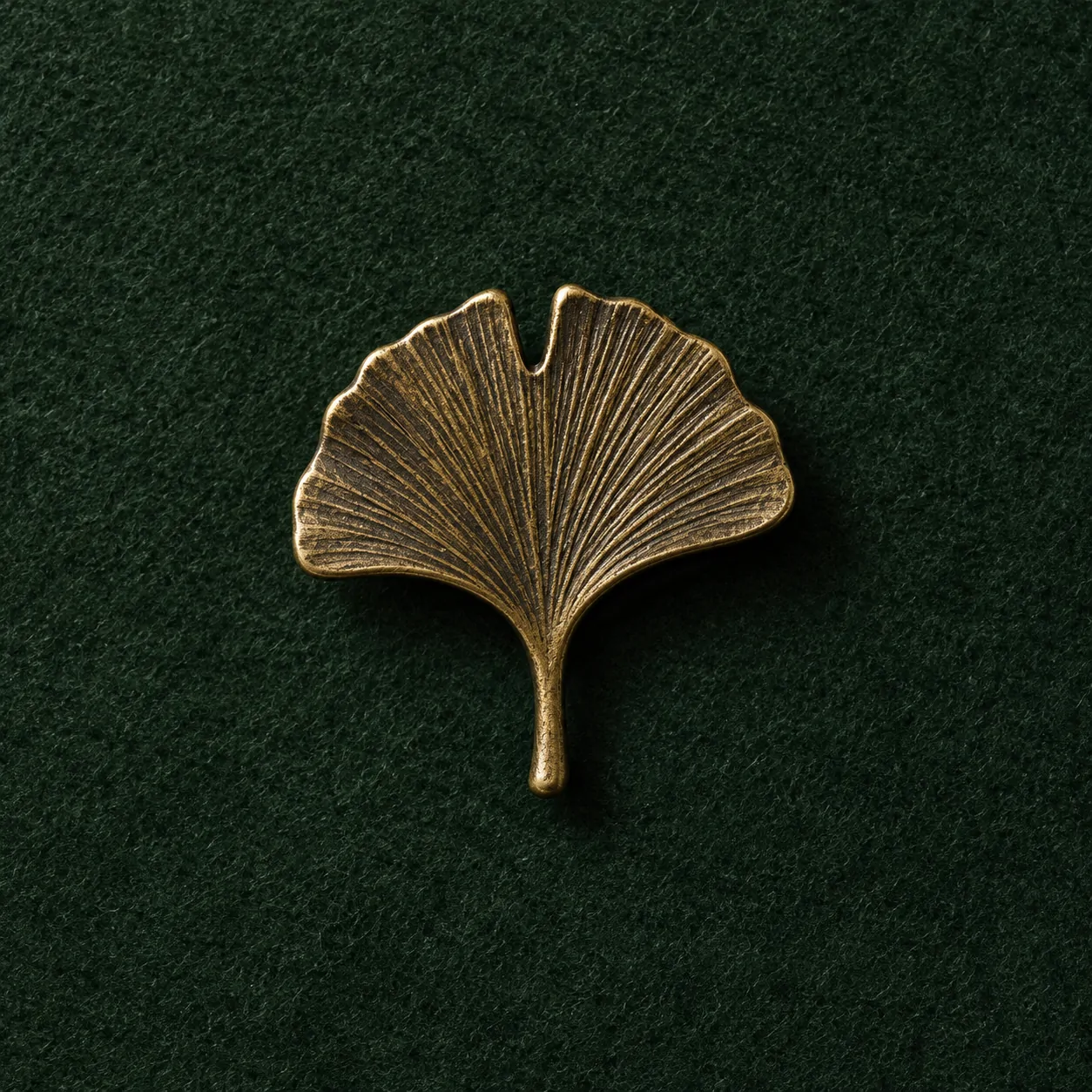 Ginkgo Leaf Lapel Pin, front view on green felt