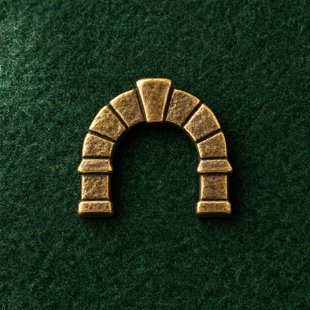 Keystone Arch Lapel Pin, front view on green felt