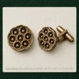 Lotus Pod Cufflinks on a millimetre scale card