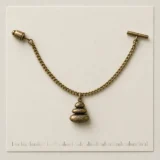 Pebble Cairn Lapel Chain on a millimetre scale card