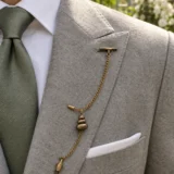Pebble Cairn Lapel Chain worn with a wedding suit