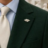 Cast Knot Lapel Pin worn with a wedding suit