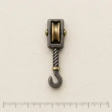 Pulley Block Lapel Pin on a millimetre scale card