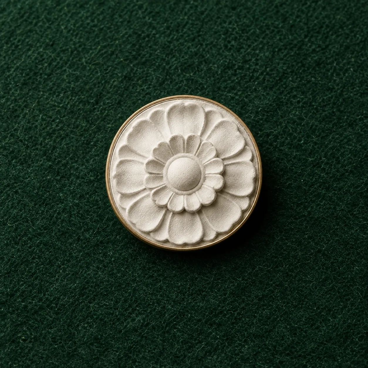 Ceiling Rosette Lapel Pin, front view on green felt