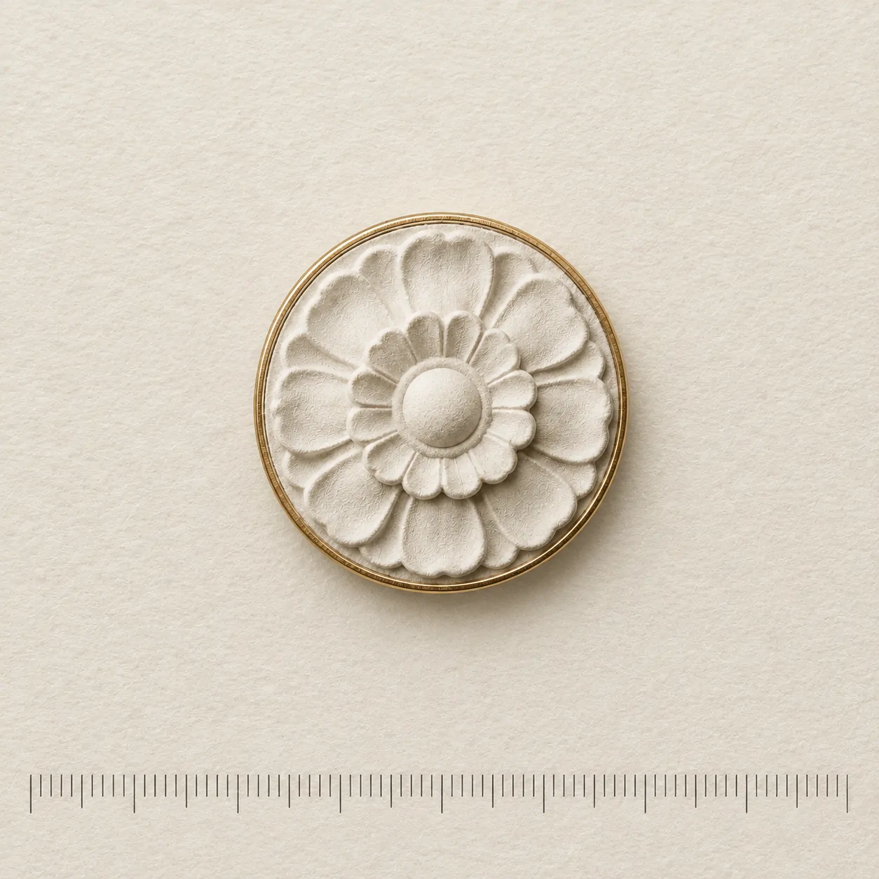 Ceiling Rosette Lapel Pin on a millimetre scale card