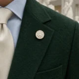 Ceiling Rosette Lapel Pin worn with a wedding suit