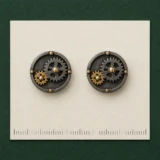 Twin Cogs Cufflinks on a millimetre scale card